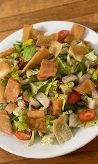 Fatouch salad with tomatoes, green peppers, lettuce, onions and pita crisps at DJ's Pizzeria in St. Albert, AB